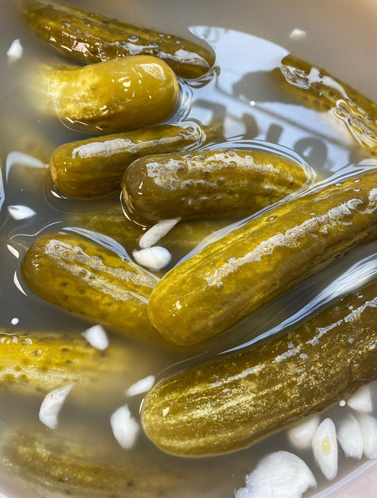 Traditional full sour pickles with garlic in brine