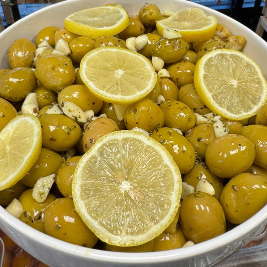 Bowl of olives with lemon slices 